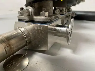 USED 2 ITT 1" & 2 ITT 1/2" 60 PSI VALVES ON MANIFOLD W/ 1/2" & 1" SANITARY FITTINGS