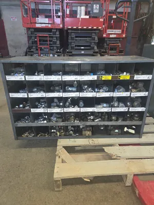 Storage bins full of Hydraulic adapters/quick disconnect fittings