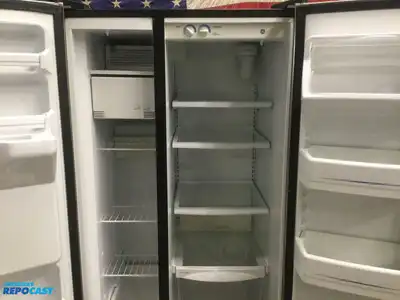 USED GE STAINLESS STEEL AND BLACK SIDE X SIDE REFRIGERATOR HEAVY DUTY ENERGY STAR
