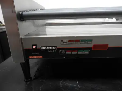 Used Nemco Used Nemco 8250-SLT 50 Commercial Hot Dog Roller Grill - Slanted Top, 120v Grills & Griddles Illinois US | Falcon Restaurant Supply #1376520