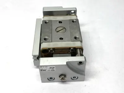 USED SMC PNEUMATIC SLIDE TABLE MISSING SHOCK ABSORBER