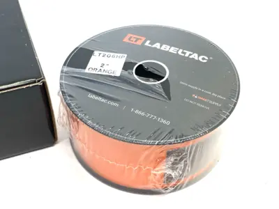 USED LABELTAC PRO MODEL HIGH PERF. 10 YEAR VINYL LABEL ORANGE, 2"X 150'/ ROLL