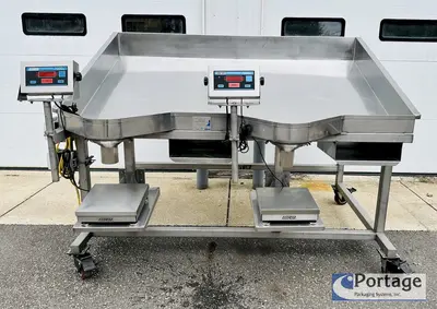 USED HEINZEN MANUFACTURING INTERNATIONAL 2720 MANUAL PACKING TABLE W/ DUAL SCALES
