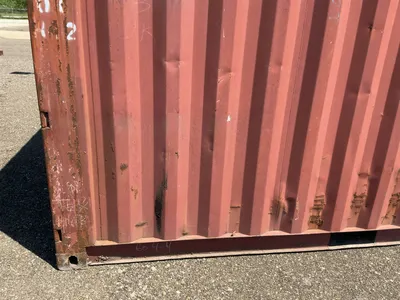 20’ Shipping / Storage Container 8’ wide x 8’ 6” tall, swing doors on one end, wood deck, rings for ...