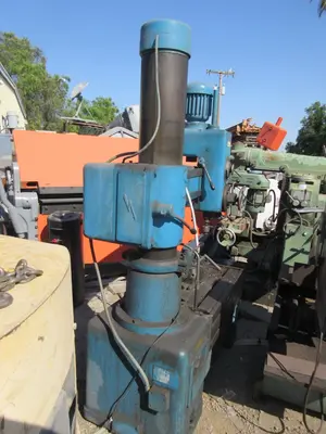 Caser, radial arm drill press