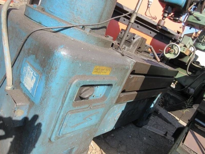 Caser, radial arm drill press