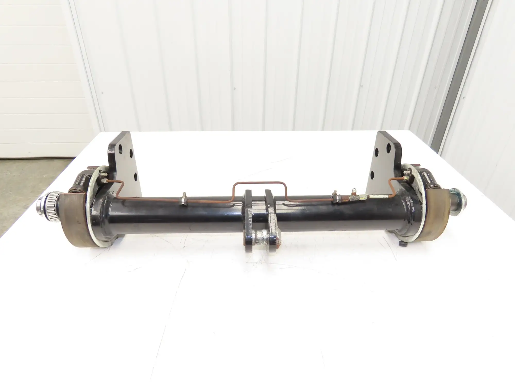 Landoll Front Axle Hub & Brake Assembly Removed From LSC30 Stand On Forklift