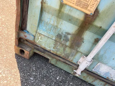 20’ Shipping / Storage Container 8’ wide x 8’ 6” tall, swing doors on one end, wood deck, rings for ...