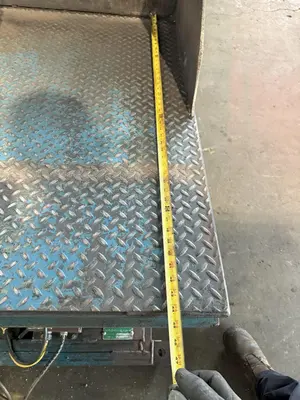 4,000 LB 48" X 48" HYDRAULIC TILT TABLE. STOCK # 1003825.