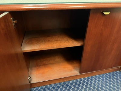 Contents of office furniture, includes (1) wood desk with glass top, 71" x 36", (1) wood credenza wi...