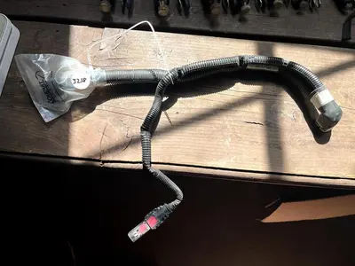 CAT Part # 506-5802.  BACK FLOW / RETURN WHITE PUMP CONNECTOR.  NEW.