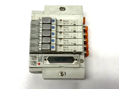 USED SMC PNEUMATIC MANIFOLD ASSEMBLY 5 STATIONS 1/4" PORTS 24VDC