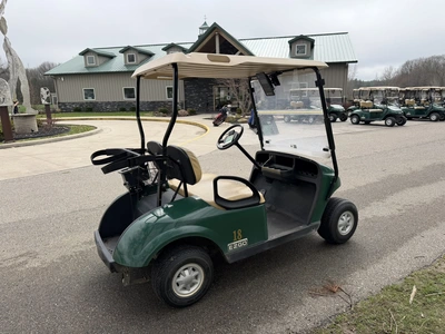 (1) 2015 E-Z-Go golf cart with a Kawasaki gas engine, does not include Club canopy, includes ball wa...