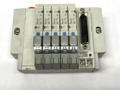 USED SMC PNEUMATIC MANIFOLD ASSEMBLY 5 STATIONS 1/4" PORTS 24VDC