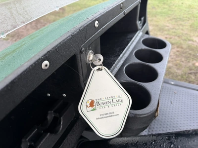 (1) 2015 E-Z-Go golf cart with a Kawasaki gas engine, includes canopy, ball cover, club cover, fold-...