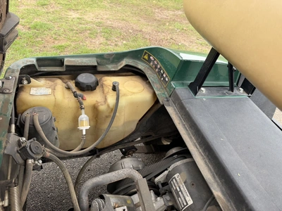 (1) 2015 E-Z-Go golf cart with a Kawasaki gas engine, does not include Club canopy, includes ball wa...
