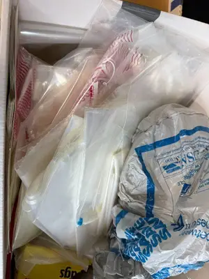 Box of Plastic Storage Bags and Round Paper Tags with Strings