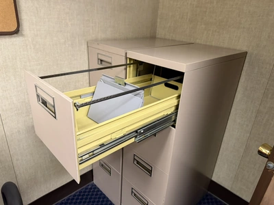 Contents of office furniture, includes (1) steel frame, wood desk, 76" x 38", (2) rolling office cha...