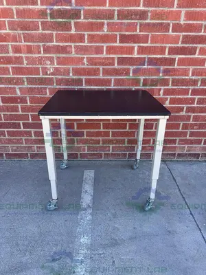 USED PHENOLIC / COMPOSITE RESIN ADJUSTABLE  SCIENCE TABLE WITH WHEELS-30" W X 36" L