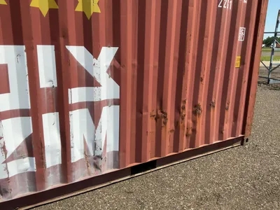20’ Shipping / Storage Container 8’ wide x 8’ 6” tall, swing doors on one end, wood deck, rings for ...