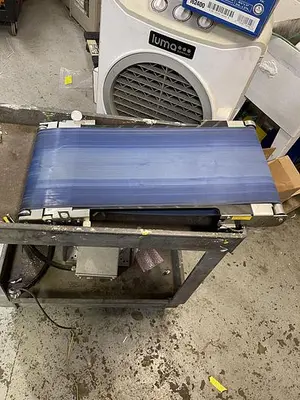 USED CONVEYOR CONVEYOR 27 1/2” LONG BY 11 3/4” WIDE.