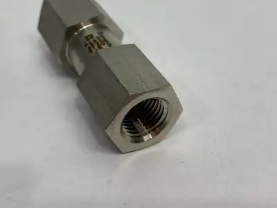 USED SWAGELOK STAINLESS STEEL POPPET CHECK VALVE, FIXED PRESSURE, 1/4" NPTF