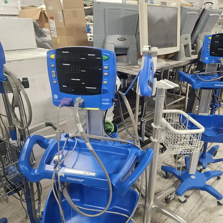 Used GE Healthcare GE Healthcare CARESCAPE DINAMAP V100 Vital Signs Monitors with Rolling Stands (Lot of 265 Units) Patient Monitors Texas US | PT Medical Technologies #1520422
