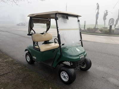 (1) 2015 E-Z-Go golf cart with a Kawasaki gas engine, includes canopy, ball cover, club cover, fold-...