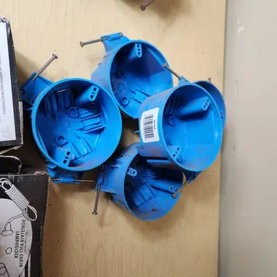 Lot of Electrical Supplies Including Porcelain Pull Chain Lampholders, GE Wall Switch Outlet, and Electrical Boxes