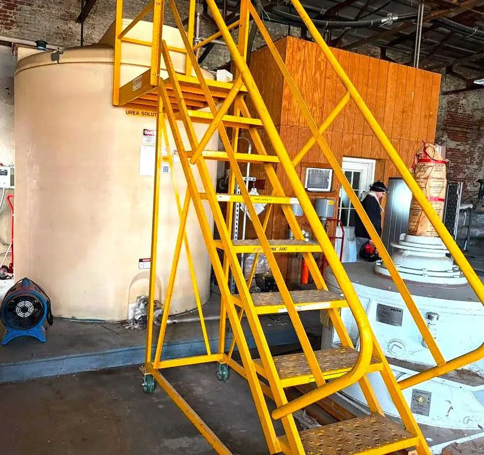 2,500 GALLON PLASTIC TANK WITH STEEL STAIRWAY