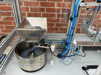 USED ROTEC PISTONMACHINE FOR VIAL CAPS / STOPPERS W/ VIBRATORY FEEDER BOWL