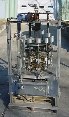 USED 12 HEAD ROTARY VACUUM FILLER 12 HEAD