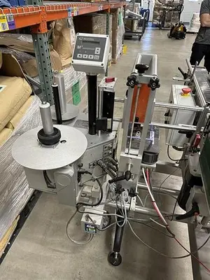 Quadrel model Moduline pressure sensitive wraparound labeler
