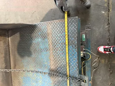 4,000 LB 48" X 48" HYDRAULIC TILT TABLE. STOCK # 1003825.