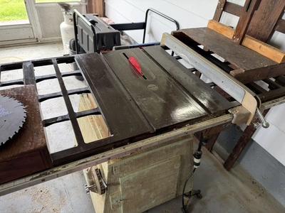 (1) Craftsman 10" table saw with stand, includes extra blades.