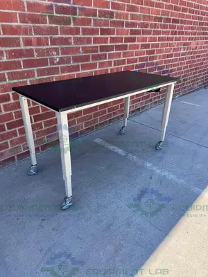 USED PHENOLIC / COMPOSITE RESIN ADJUSTABLE  SCIENCE TABLE WITH WHEELS-30" W X 62" L