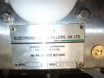 6 Head ELF Filler with feed tanks & container link belt conveyor