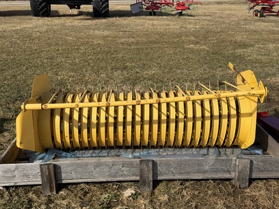 (1) approx. 5' wide pickup unit for a hay baler, unit has some damage, is listed for parts or repair...