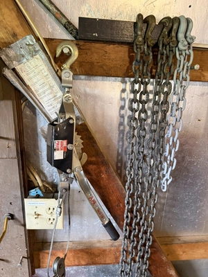 Lot of assorted chains with hook ends, and (1) cable winch puller, 4000 lb. capacity.