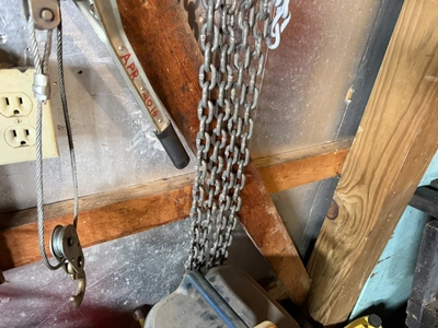 Lot of assorted chains with hook ends, and (1) cable winch puller, 4000 lb. capacity.