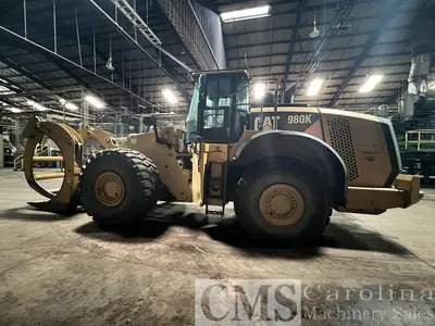 USED 2013 CAT 980K WHEEL LOADER WITH LOG FORKS