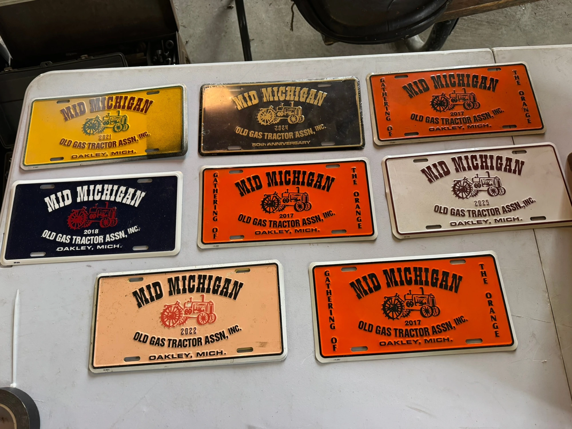 (8) Assorted license plates