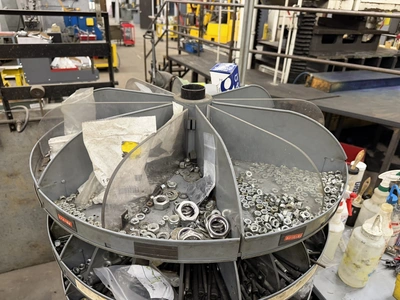 (1) 7-tier lazy Susan style parts rack, approx. 66" tall, includes assorted socket head cap screws, ...