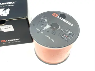 USED LABELTAC PRO MODEL HIGH PERF. 10 YEAR VINYL LABEL, ORANGE 4" X 150'/ROLL