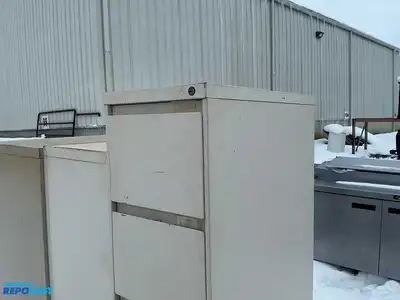 Lot of (2) metal filing cabinets including a 15”x29”x52” cabinet with 4 drawers and a 15”x29”x59”...