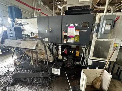 Used FUJI ANW 35 TWIN TURRET CNC LATHE, TAIL STOCK WITH ROBOT LOAD/UNLOAD AND STOCKER TABLES CNC Lathes | Harbor Machinery Inc. #1283395
