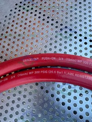 USED SWAGELOK PUSH ON 124" FLAME RESISTANT HOSE 3/4” 300PSIG W/ QUICK RELEASE FITTING