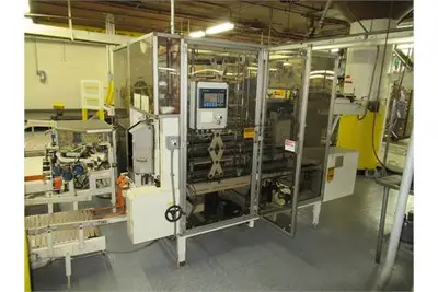 Dyna Pak A.C.P. - 2 vertical case packer w/ programmable control