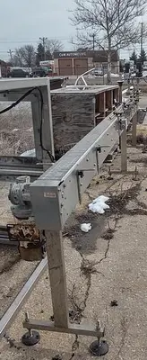 Inline Filling Systems capper with Waterfall feeder