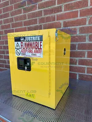 USED JUSTRITE 4 GALLON FLAMMABLE LIQUID STORAGE CABINET W/ SOFT CLOSE DOORS, KEY
